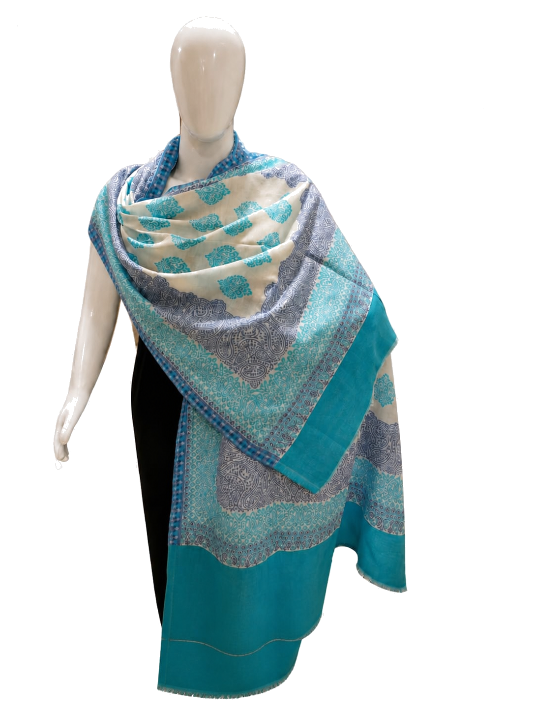 Blue and turquoise paisley textile draped over a mannequin